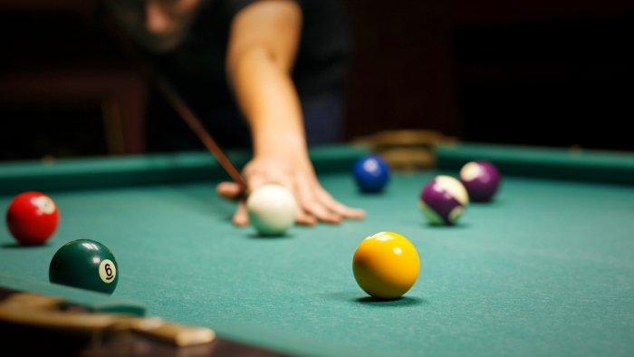 person playing snooker