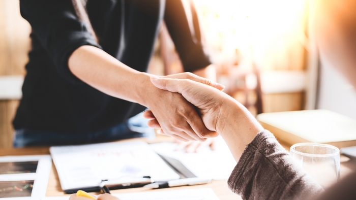 persons shaking hands